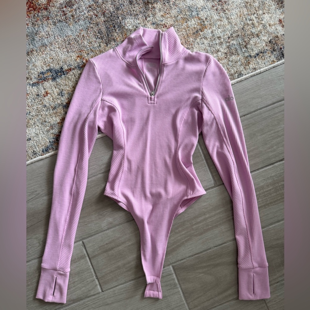 ALO Yoga Ribbed Long Sleeve Zip-Front Bodysuit in Light Pink